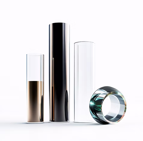 Three tall cylindrical glass tubes and one glass ring on a white background.